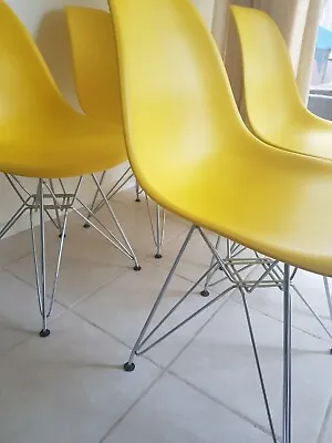 $50 • Buy 4 Yellow Plastic Dining Chairs In Excellent Condition