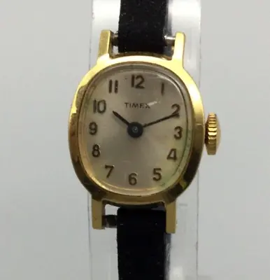 Vintage Timex Watch Women Gold Tone Oval Dial 17mm Black Band Manual Wind • $21.24