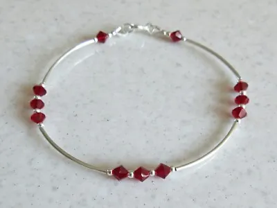 Elegant Sterling Silver Bangle Bracelet With Ruby Red Swarovski Crystals  • £25