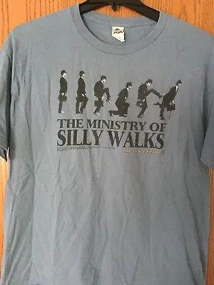 Monty Python.  “The Ministry Of Silly Walks”.  Shirt.  2013.   Blue.  XL • $35