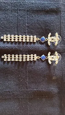 Auth. COCO Chanel White Crystal Dangling CC Logo Earrings With Blue Stone • $299