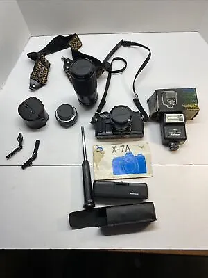 Minolta X-7A 35mm Film SLR Camera W/ 3 Lenses PLUS EXTRAS. • $35