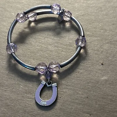 C J Sardi Bracelet With Purple Horseshoe Charm. Silvertone • $9.96