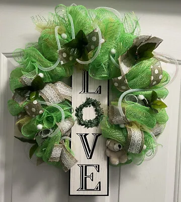 ‘LOVE’ Green Mesh Wreath.  Handmade On 14”. • $25