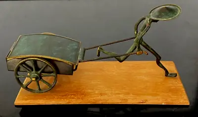 $110 • Buy Vintage HAKULI Israel Bronze  Man Pulling Lidded Cart Wood Base Foil Label