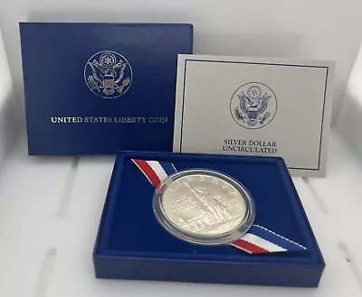 1986 LIBERTY SILVER DOLLAR  ELLIS ISLAND  UNCIRCULATED W/ Box & COA America • $24.99