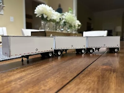 DCP 1/64 Wabash Triple 28’ Dry Goods Pup Trailers White W/ Converter Dollies • $110