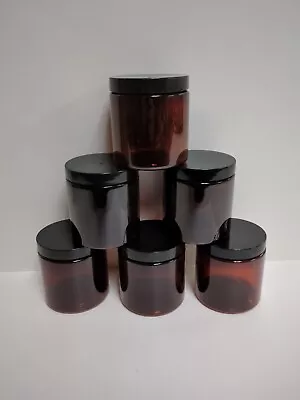 Six 8 Oz Amber Plastic Jars With Lids  • $10.46