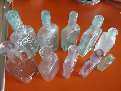 Lot Of 10 Small Vintage Clear Embossed Glass Bottles Medicine Apothocary  • $40