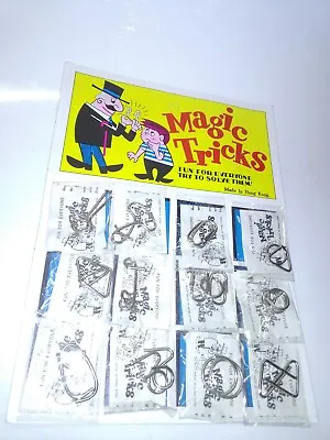 Vintage Metal Puzzle Magic Tricks Toy Store Display Card W/Puzzle Toys  • $19.99