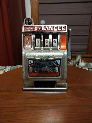 Vintage LeBanque One Arm Banker Toy Slot Machine Coin Carousel Bank • $34.95