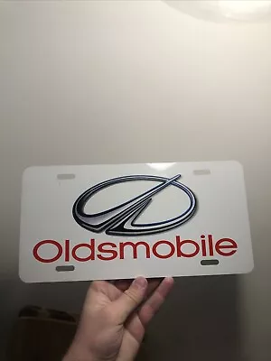 1990s Oldsmobile Automobile Booster License Plate Showroom License Plate Tag • $14.99