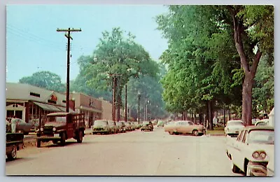 1950s Postcard NEW MILFORD CONNECTICUT  MAIN ST Autos/stores • $8