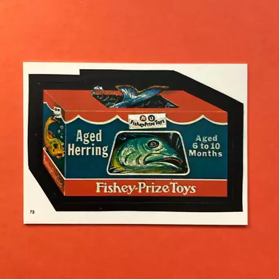 1986 Wacky Packages Fishey Prize Toys #73 Topps Album Sticker Fisher Price • $2.49