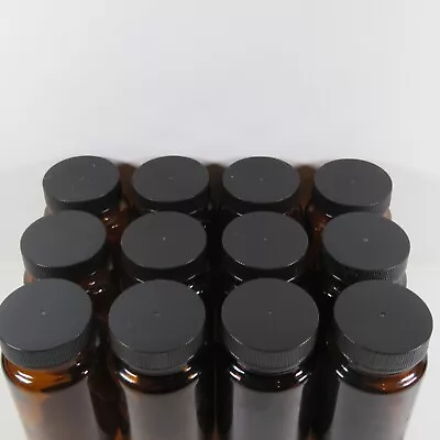 12 Amber 2 Ounce Glass Bottles With Wide Mouth Lid • $16.99