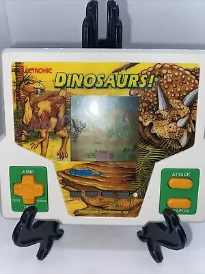 Tiger Electronic Handheld LCD Game  Dinosaurs • £24.99