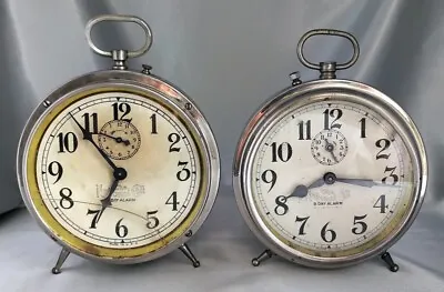 Lot (2) Antique NATIONAL CALL 8 Day Alarm Clocks Silver W/ Peg Legs - For Parts • $75