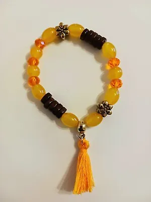 Ethnic African Beaded Bracelet. Jewellery. Yellow Coloured With Cotton Tassel  • £1.19