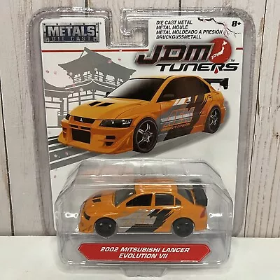 Jada Metals Die Cast JDM Tuners 2002 Mitsubishi Lancer Evolution Vll Orange 1:64 • $12.50