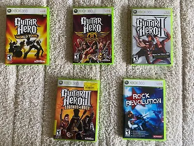 $50 • Buy Guitar Hero Xbox 360 Lot Of 4 Games And BONUS Rock Revolution Game 