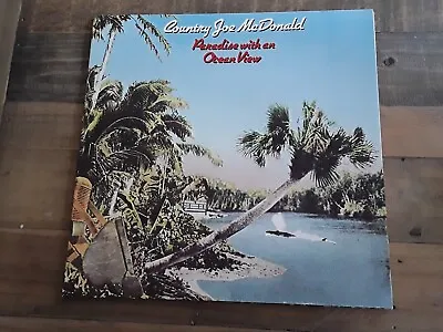 COUNTRY JOE MCDONALD Paradise With An Ocean View 1975 LP NM/NM FTA 3002 Vinyl • £8