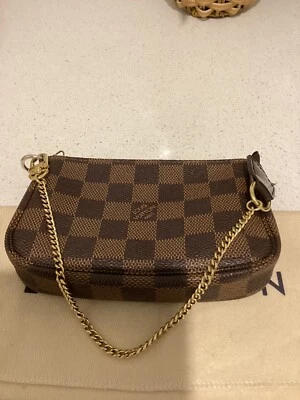 $720 • Buy Authentic Louis Vuitton Mini Pochette Damier Ebene