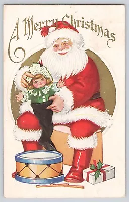 Postcard Christmas Santa Claus Holding Doll Drum Gifts Embossed Vintage • $7.95