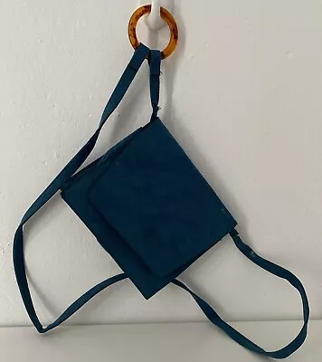 Matalan Teal Coloured Faux Suede Crossbody Bag With Amber Coloured Ring Strap. • £8.99