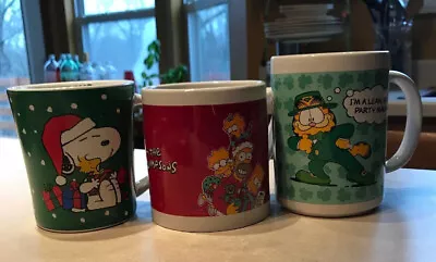The Simpsons Garfield Snoopy Peanuts Holiday Mugs Lot 3 Christmas St Patrick’s • $17.50