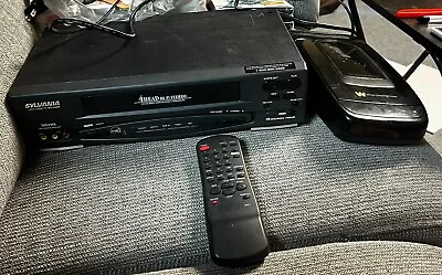 Sylvania 4 Head VCR Model SSV6001 With Video Tape Rewinder Cords Remote • $45