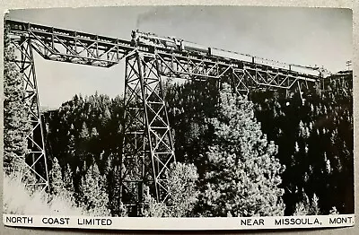 RPPC Postcard Missoula MT - North Coast Limited Train Crosses Railroad Bridge • $12