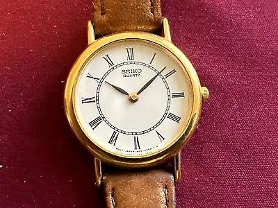 Vintage Seiko Watch Woman's Gold Tone White Dial 25mm Round 1N00-0H80 Leather • $11.99