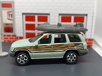 1999-2004 Jeep Grand Cherokee 4x4 Woody With Raft Boat 1/64 Matchbox • $19.95