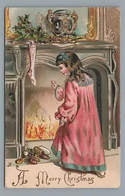 A Merry CHRISTMAS Girl By Fireplace Hanging Stockings Vintage Postcard • $4.99