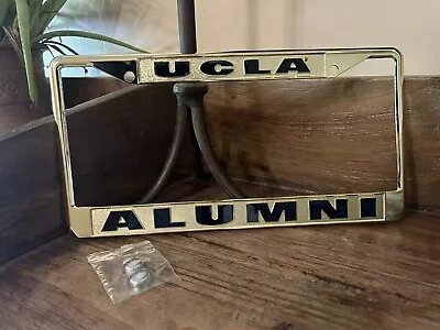 NEW IN PACKAGE METAL UCLA ALUMNI License Plate Frame Cover GOLD/BRASS 🚘 • $34.90