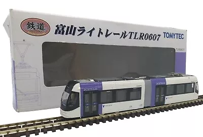 Working Tomytec N Gauge TLR0607 Toyama Portram Tram In White W/ Purple Doors • £100