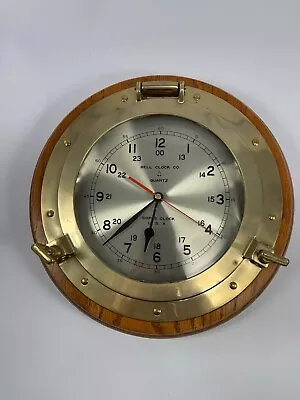 Vintage Ships Clock Heavy Brass Porthole Portal Bell Clock Co Oak Base • $59.99