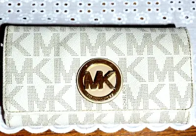 Michael Kors White Monogrammed Trifold Wallet. • $45