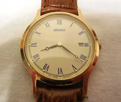 Vintage Mens  Seiko  Gold Tone Day Window Roman Numeral Quartz Watch • $130