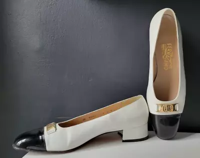 FERRAGAMO IVORY LEATHER BLACK PATENT CAP TOE PUMPS W/ GOLD SIGNATURE BUCKLE • $69