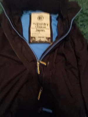 £3 • Buy Super Dry Boys Black Raincoat With Fleece Interior And Cuff Detail. Size Small. 