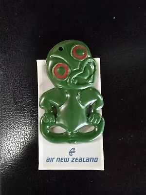 Vintage AIR NEW ZEALAND Maori Tiki Talisman Souvenir Plastic Pendant & Paper • $5