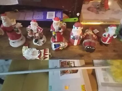 Lot Of 8 Santas • $20