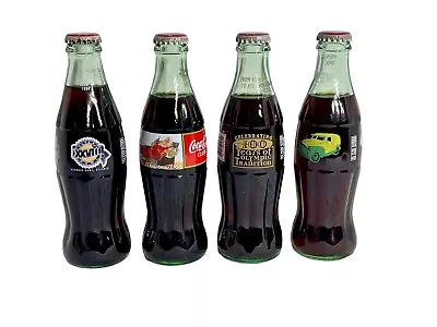 Lot Of 4 Commemorative Coca Cola Bottles Unopened Set Of 4 Collectible  • $30