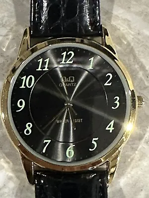 QQ Black Dial New Battery Round Gold Tone Case Black Faux Leather Band Watch A • $19.99