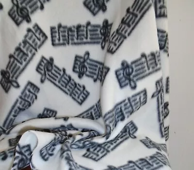 Musical  FLEECE FABRIC 70  Wide X 40  Long Black Music Notes On Off-White • $14.99