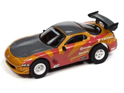 Auto World 1995 Mazda RX-7 (Gold/Red) Import Heat X-Traction HO Slot Car • $24.99