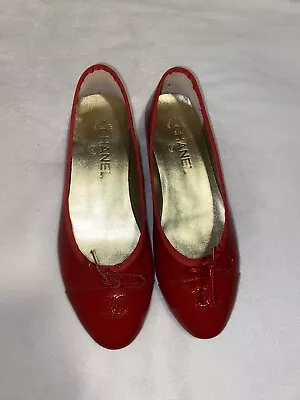 Red Chanel Ballet Flats • £240.94