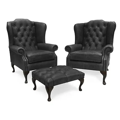 Pair Of Chesterfield High Back Wing Chairs & Footstool In Vintage Black Leather • £1565