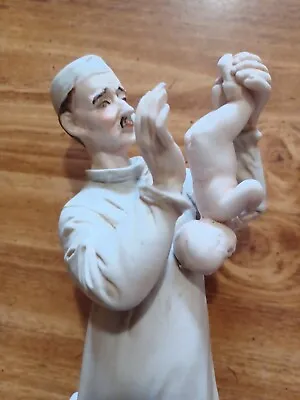 Vintage Porcelain Doctor Holding Baby 11 Inchs  Tall Baby   Porcelain Figure    • $22